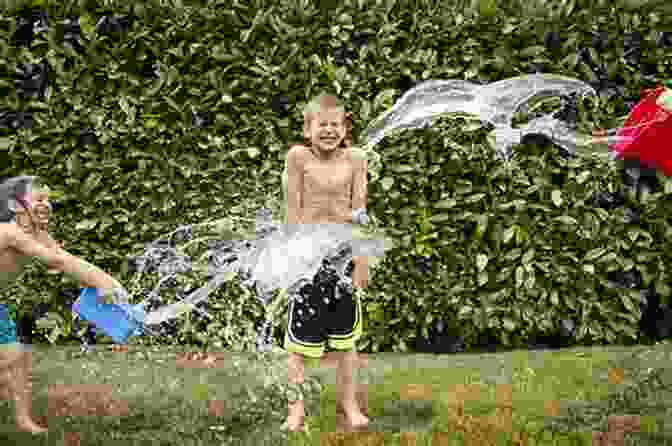 A Young Boy Playing In The Water Overcoming Aquaphobia For Children With 5 Simple Steps