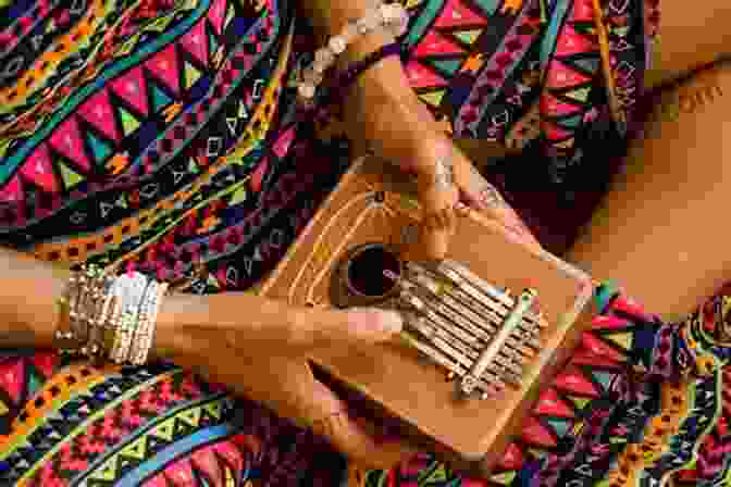 Hands Playing The Kalimba, Creating Beautiful Music How To Play The Kalimba: Essential Guide For Beginners